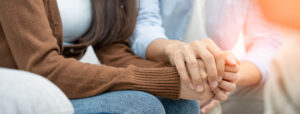 Couple hold hands to support each other while discussing family issues with a psychiatrist. Husband encourages wife suffers depression. psychological, save divorce, Hand in hand together, trust, care