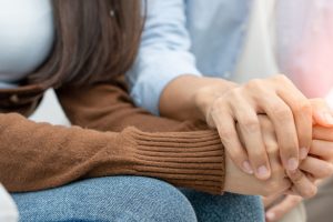 Couple hold hands to support each other while discussing family issues with a psychiatrist. Husband encourages wife suffers depression. psychological, save divorce, Hand in hand together, trust, care Couple hold hands to support each other while discussing family issues with a psychiatrist. Husband encourages wife suffers depression. psychological, save divorce, Hand in hand together, trust, care
